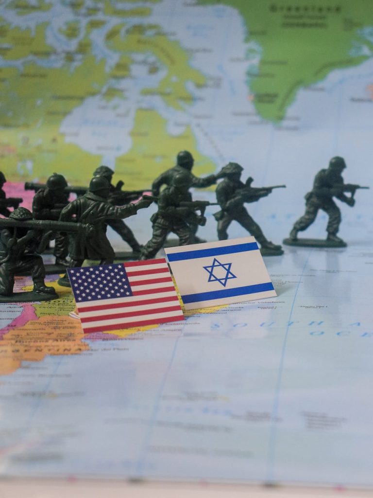 military toy soldiers on world map with flags