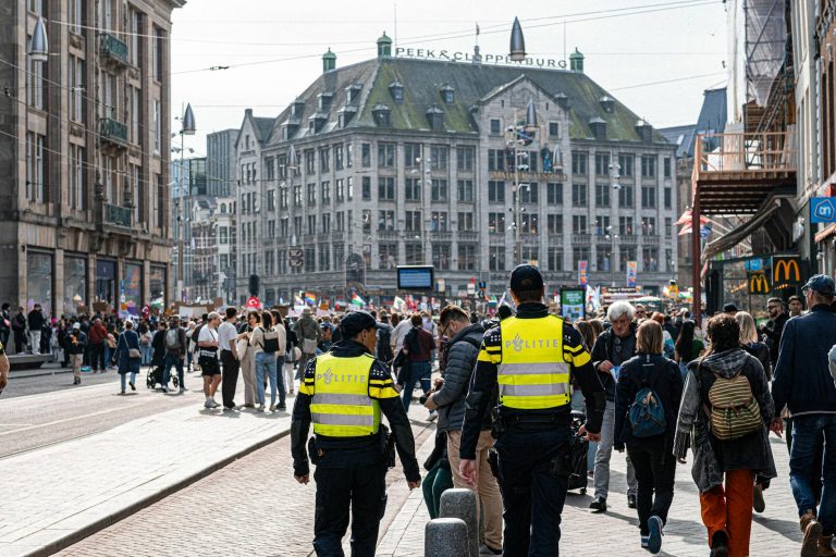 crowded european street scene with police presence