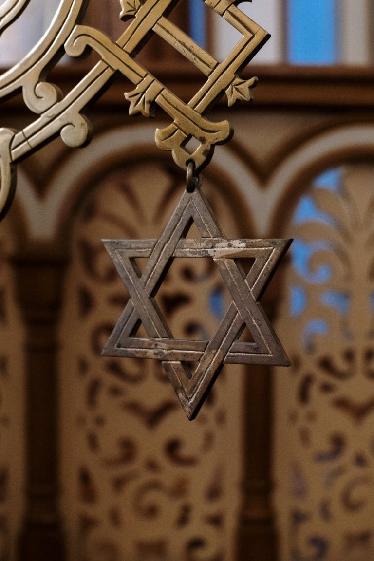 a close up shot of a hanging star of david accessory